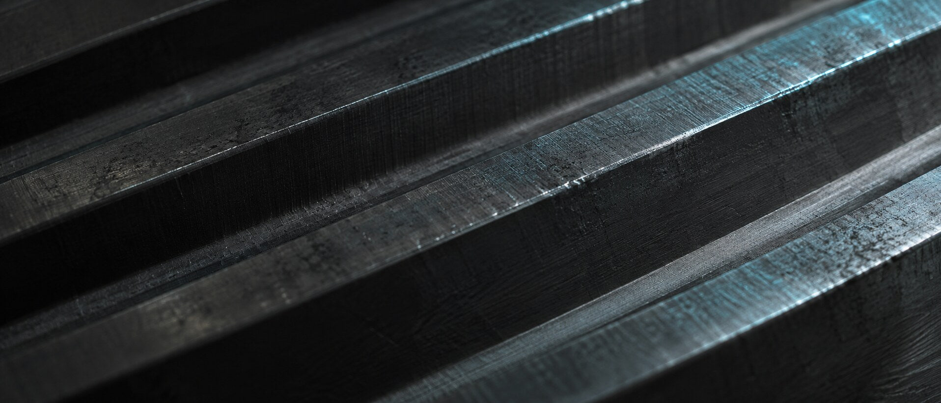 Dark matte metal surface with precise machined lines